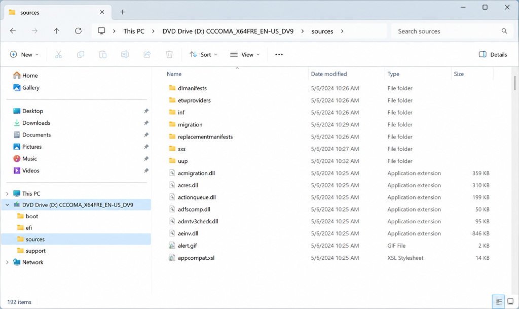 File Explorer inside the ISO's > `sources` folder with `install.wim` or `install.esd` clearly